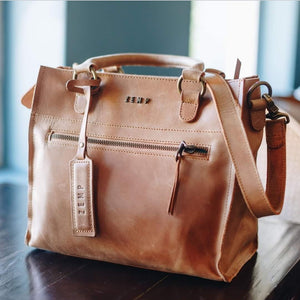Size: 27 x 23 x 15 cm

The Bastille grab-and-go bag is a standout everyday addition to any wardrobe. It’s effortless, timeless design fits in with any style. The epitome of functionality and fashion.

Vegetable tanned leather
Unlined (RAW)
Antique Brass hardware
Inside and outsize zips &amp; multi-functional open pockets
Top zip closure
Handle drop 12 cm
Detachable shoulder strap 98 – 108 cm