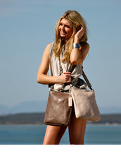 Description Length: 26 cm Height: 29 cm Width: 5 cm Shoulder Strap:Min: 100 cmMax: 116 cm Zip: Metal YKK zip Lining: 100% Turquoise Cotton Twill Fitting: Antique Brass The Boston Crossbody Bag is a great everyday bag. Wear this bag with just about any outfit you choose! The adjustable strap allows you to carry the bag over your shoulder or wear it across your body. The internal pockets allow for easy organisation of your smaller items and the zip pocket will keep your secrets safe. The external slip pocket 
